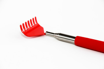 metal red rake tool on a white background
