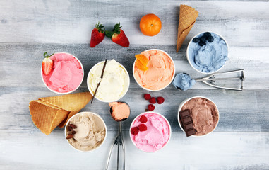 Various of ice cream flavor with fresh blueberry, strawberry, almond, chocolate, vanilla setup on rustic background . Summer and Sweet cold ice cream