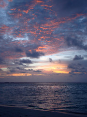 A beautiful and romantic sunset at the Maldives seen from a luxurious villa. Holidaying in Maldives without seeing a sunset is a bit like going to Paris without seeing the Eiffel Tower.