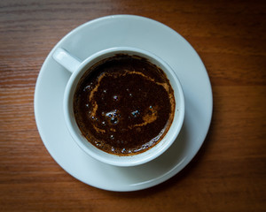 cup of coffee on wooden background