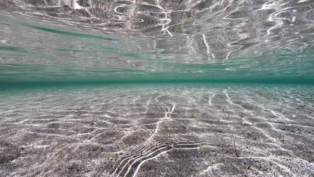 Shallow sand under water surface, natural scene, Mediterranean sea, France