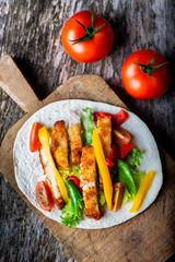 chicken fajitas on a wooden board