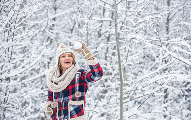 Fototapeta na wymiar I cant believe in it. snowball holiday on winter day. beautiful woman in warm clothing. Enjoying nature wintertime. Portrait of woman in winter. Cheerful girl outdoors. joyful and energetic woman