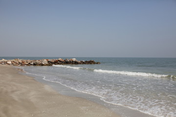 Empty thai beach with a quiet sea
