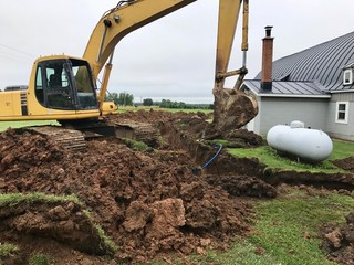 Excavator digging a trench