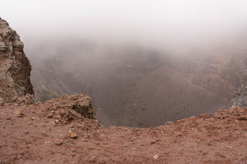 Vesuvius Crater in the clouds in cloudy weather, Italy