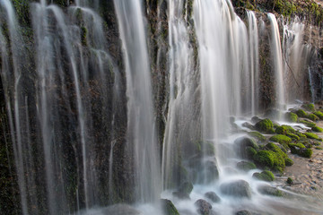Fototapeta na wymiar Scenic waterfall in Karuizawa Japan. Shiraito Falls. Winter