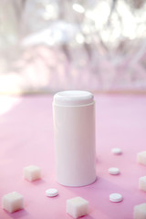 Sugar cubes and sweetener on purple background. Diabetes, sugar disease, unhealthy food, diet concept. Copy space