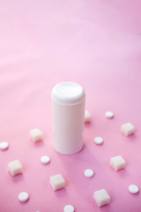 Sugar cubes and sweetener on purple background. Diabetes, sugar disease, unhealthy food, diet concept. Copy space