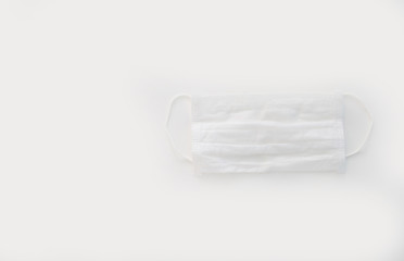 medical mask on a plain background with flowers