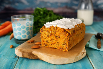 Delicious vegan carrot cake on aqua menthe blue background