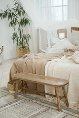 Beautifully decorated farmhouse look. cozy textiles blankets on the bed and pillows as an element...