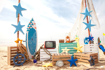 Set design on beach for summer surf fishing photobooth