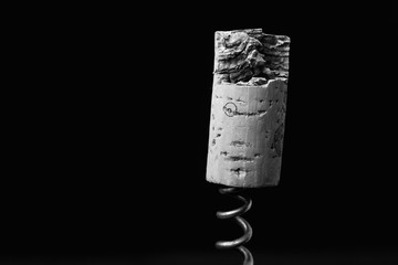 wine stopper and corkscrew close up on a black background. Empty space