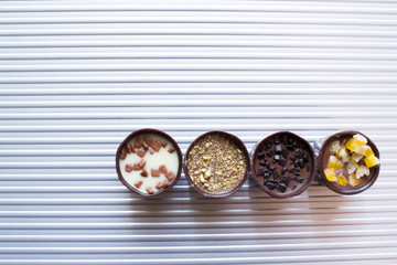 Various of sweet confectionery with chocolate candies and pralines. Handmade box of chocolates. Realistic chocolate set, delicious dessert pattern.