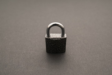 Metal lock isolated on black background.