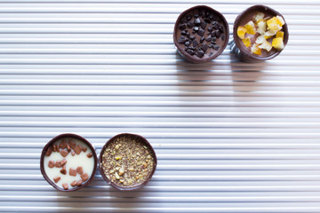 Various of sweet confectionery with chocolate candies and pralines. Handmade box of chocolates. Realistic chocolate set, delicious dessert pattern.