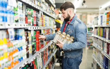 man shopping canned beer