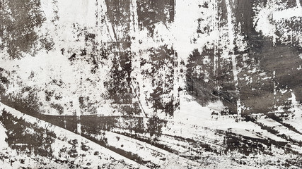 Fototapeta premium Weathered and aged concrete wall with paint, mostly peeled from black and white with vignetting. Shades of gray and white. Great modern, textured background. Abstract old background