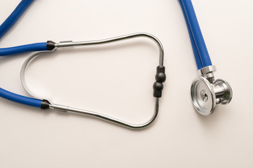 Stethoscope on white background, top view. Medical instrument