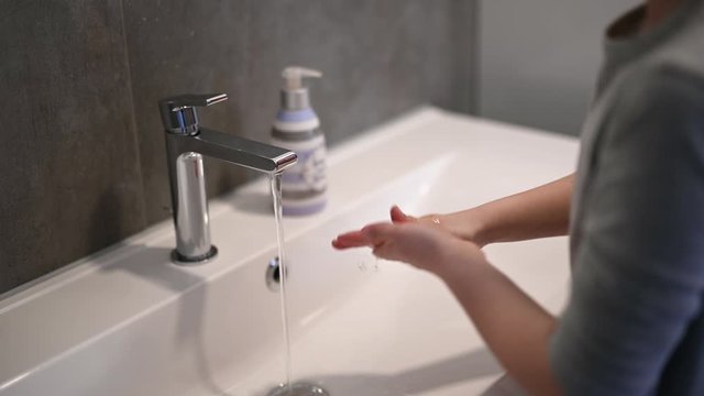 Corona virus prevention child showing hand hygiene washing hands with soap