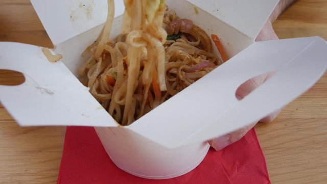 Asian noodles in a takeout box - chinese thai delicious vegan food