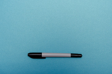 Color marker on blank blue textured paper