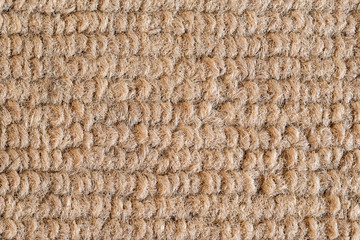 Texture of dark beige fabric close-up, fabric texture.