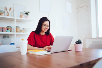 Beautiful woman with laptop working at home