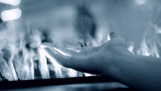 Artificial electrofireplace glowing backlight close-up.
