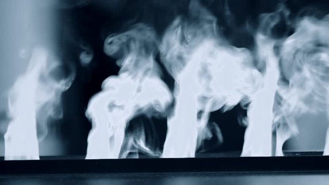 Artificial electrofireplace glowing backlight close-up.