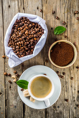 Cup of espresso with coffee beans
