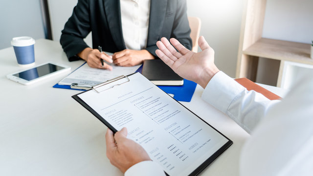 Job interview, Corporate business Employer or recruiter around the table during interviewing recruitment process concept.