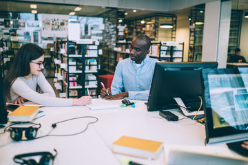 Attentive mates studying in library