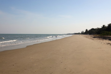 Fototapeta na wymiar Empty thai beach with a calm sea