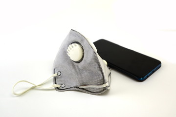 Mask placed near the phone and white background