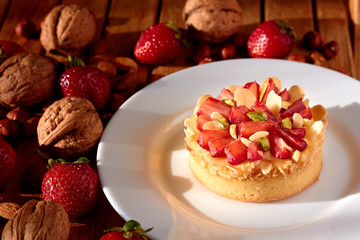 Mini tart cupcake with strawberries on plate. Close up