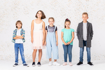Fototapeta premium Group of happy children is standing together in a room