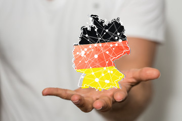 a virtual germany land  map digital in hand 3d