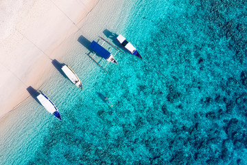 Boats on the water surface from top view. Azure water background from top view. Summer seascape from air. Travel - image