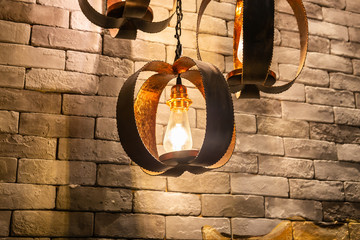 Closeup of Decorative antique edison style filament light bulbs on brick wall background