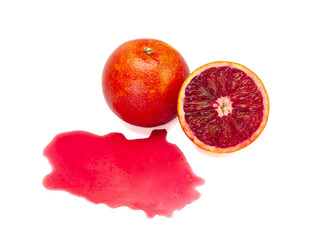 Red blood orange and its juice isolated on a white background