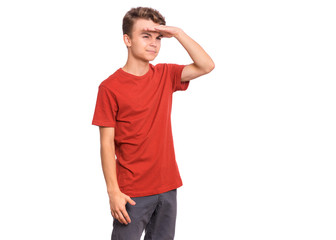 Portrait of serious teen boy looking far away with hand over head. Searching concept. Beautiful child holding hand at forehead looking far away distance, isolated on white background.