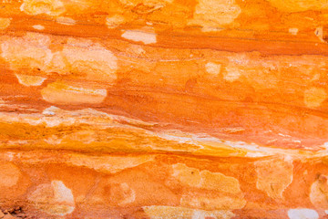 Beautiful colours and textures of a sandstone wall at Broome coastline