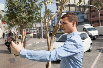 Caucasian male tourist makes selfie on smartphone in arab country. Dubai Lexa 01 03