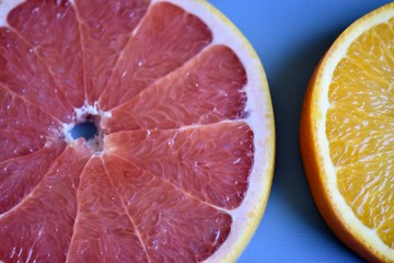 pink grapefruit on a blue background 