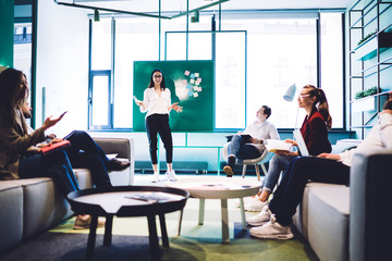Charismatic spokeswoman making presentation for colleagues