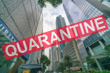 Obraz premium Coronavirus pandemic quarantine sign with blurred background of Makati city