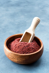 Sumak - a spice from the ground berries of one of the types of sumac reddish-burgundy with a sour taste. It is used in Turkish and Levantine cuisine for salad dressing. Copy space.