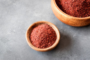 Sumak - a spice from the ground berries of one of the types of sumac reddish-burgundy with a sour taste. It is used in Turkish and Levantine cuisine for salad dressing. Copy space.